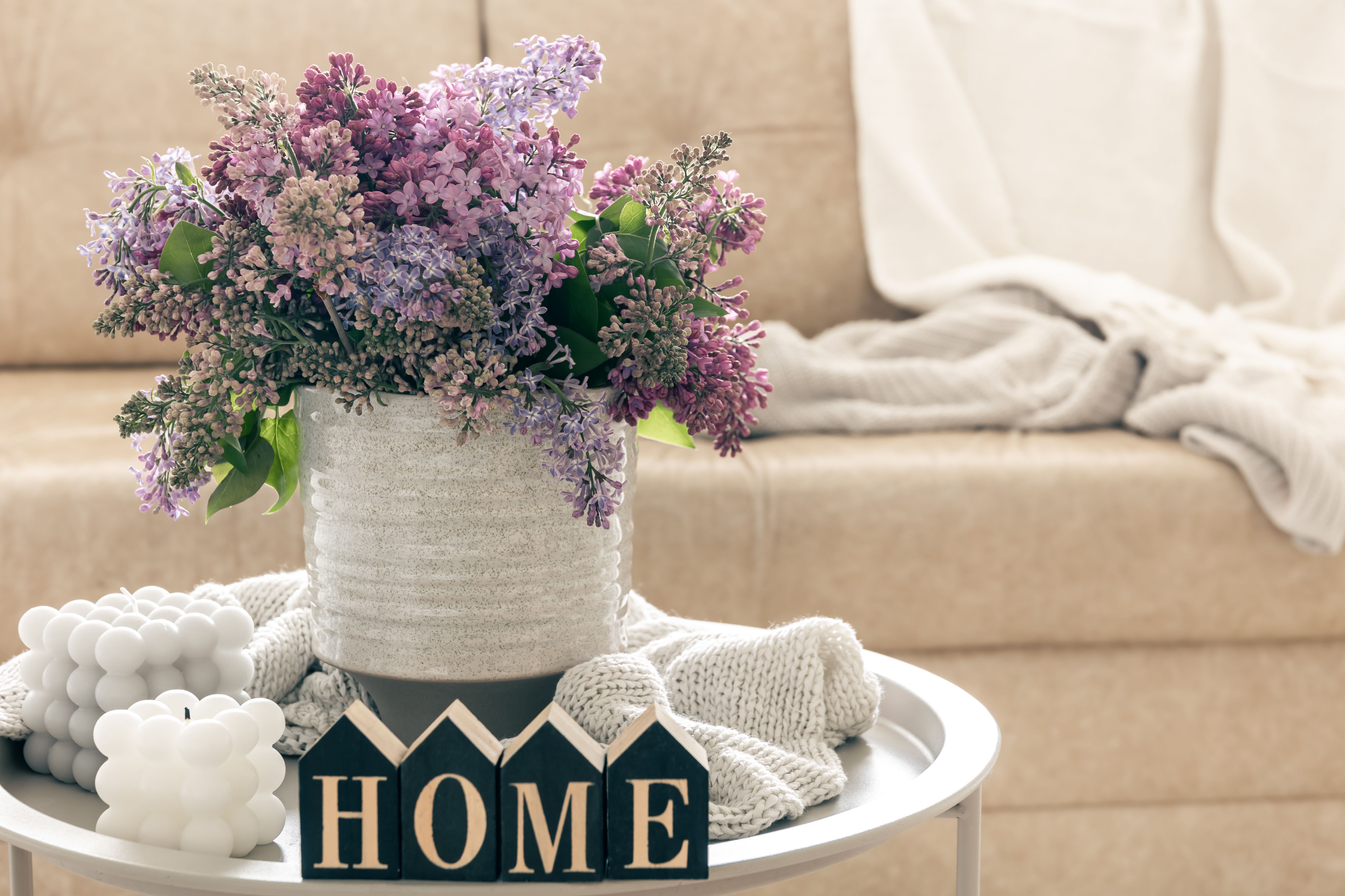 composition-with-lilac-flowers-candles-decorative-word-home.jpg